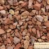 3/4" Red Brick is crushed red brick tile screened to a consistent 3/4" sized clear stone. This decorative product will make any garden demand attention. This vibrant red stone can be used as ground cover that still allows water to drain through to the plants surrounding it. 